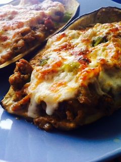 Una foto de Berenjenas rellenas de verduras con queso crema