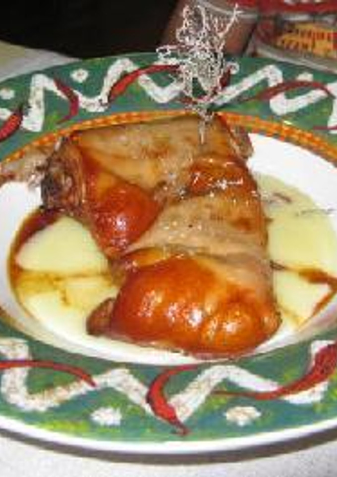 Una foto de Cochinillo asado