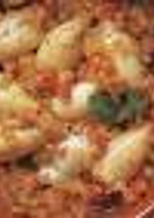 Una foto de Calamares al vino en salsa de tocino