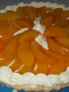 Una foto de Tarta de duraznos en almíbar