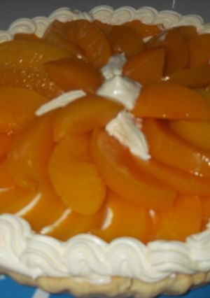 Una foto de Tarta de duraznos en almíbar