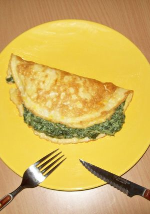 Una foto de Tortilla con queso y espinacas