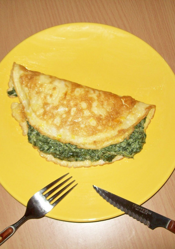 Una foto de Tortilla con queso y espinacas