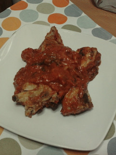 Una foto de Conejo en salsa de tomate con pimientos
