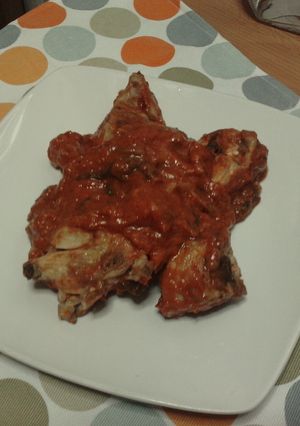 Una foto de Conejo en salsa de tomate con pimientos