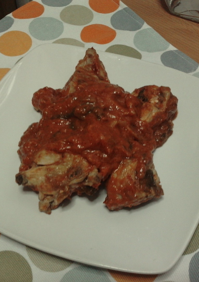 Una foto de Conejo en salsa de tomate con pimientos