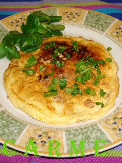 Una foto de Tortilla de nueces, avellanas y pasas
