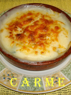 Una foto de Espinacas gratinadas con piñones y pasas