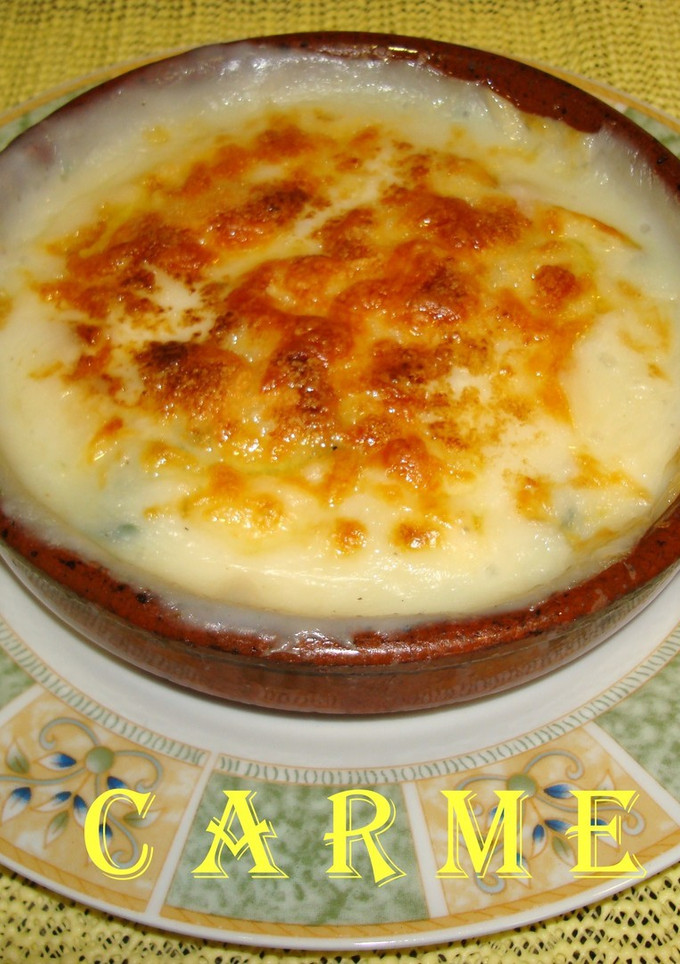 Una foto de Espinacas gratinadas con piñones y pasas