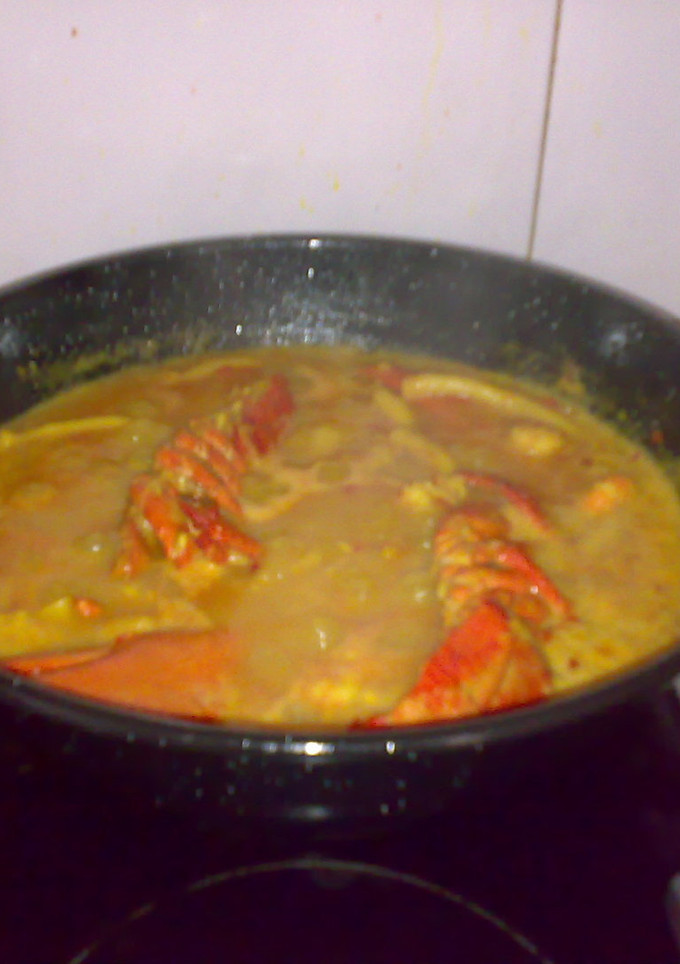 Una foto de Arroz con bogavante, chirlas y calamares