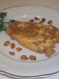 Una foto de Pescadilla rebozada con maíz frito