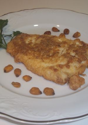 Una foto de Pescadilla rebozada con maíz frito