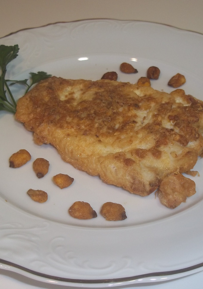 Una foto de Pescadilla rebozada con maíz frito