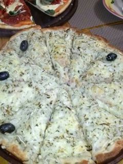 Una foto de Pizza fugazzeta rellena