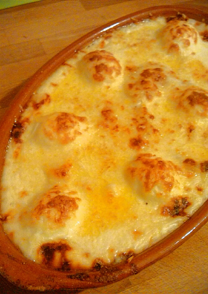 Una foto de Gratinado de patatas con bacalao y huevos duros