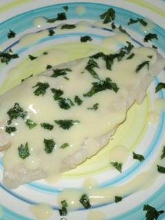 Una foto de Filetes de panga al horno en salsa de vino al limón