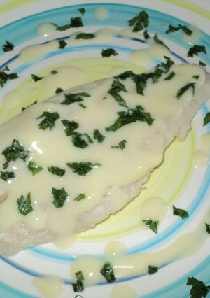 Una foto de Filetes de panga al horno en salsa de vino al limón