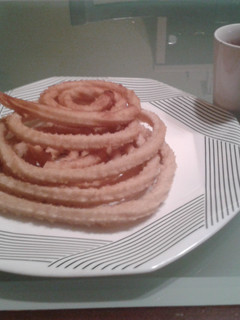 Una foto de Churros con chocolate