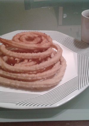 Una foto de Churros con chocolate