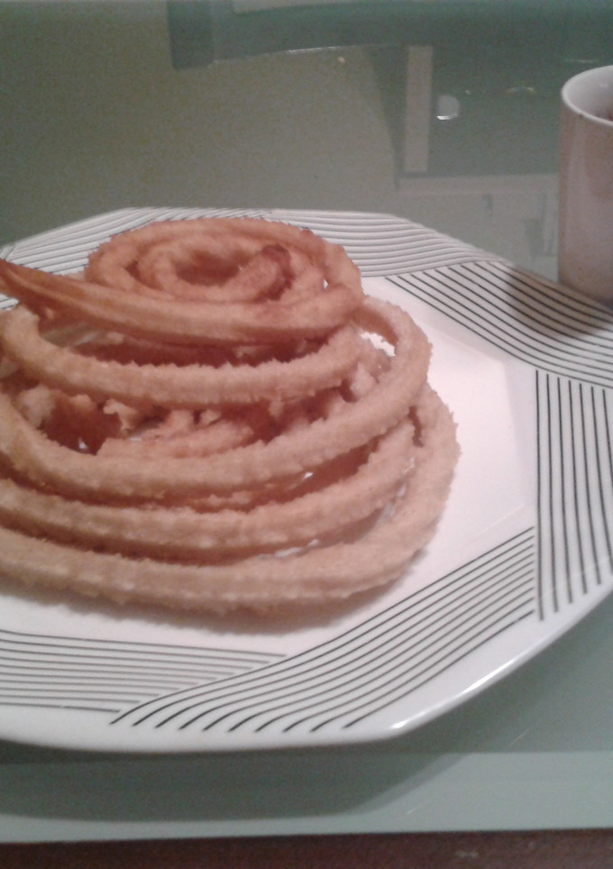 Una foto de Churros con chocolate