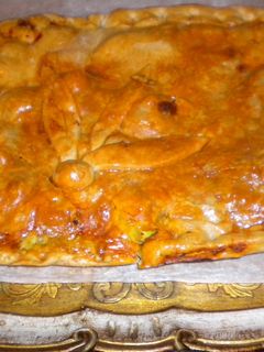 Una foto de Empanada de carne y alcachofas