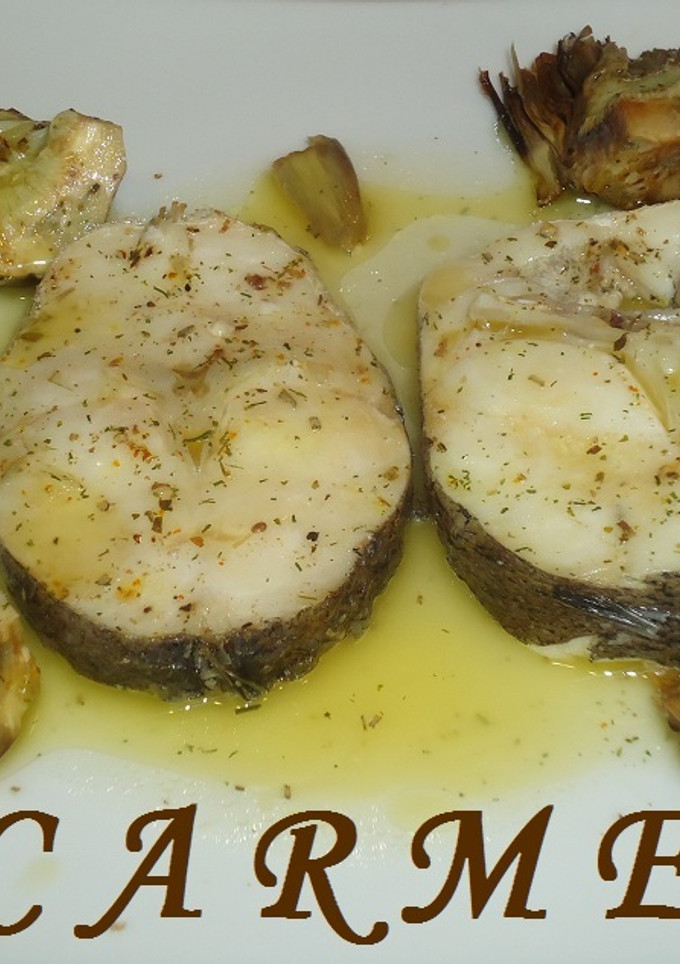 Una foto de Merluza con alcachofas en papillote