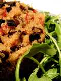 Ensalada caliente de amaranto y senderuelas con jamón ibérico y ajo negro