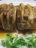 Lomo en rodajas alteranadas con láminas de patatas