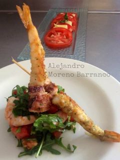 Una foto de Gamberetti con rucola