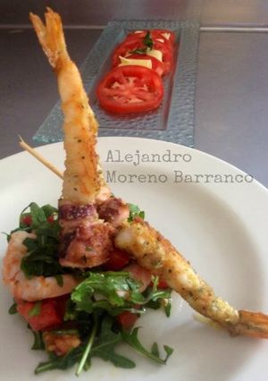 Una foto de Gamberetti con rucola