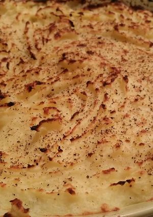 Una foto de Puré de papas gratinado