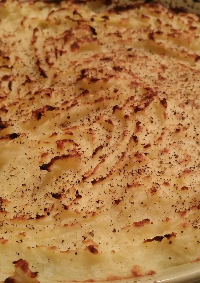 Una foto de Puré de papas gratinado