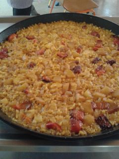 Una foto de Arroz con cebolla y bacalao