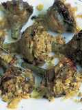 Alcachofas al horno con almendras mollar y hierbas aromáticas