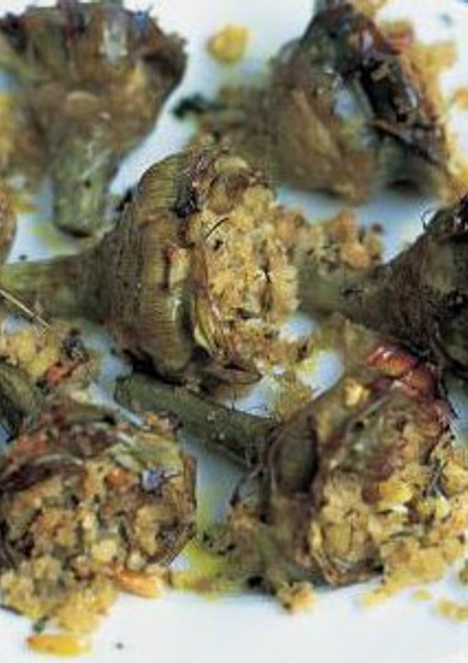 Una foto de Alcachofas al horno con almendras mollar y hierbas aromáticas