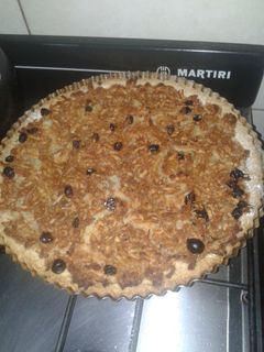 Una foto de Tarta de manzana, canela y pasas