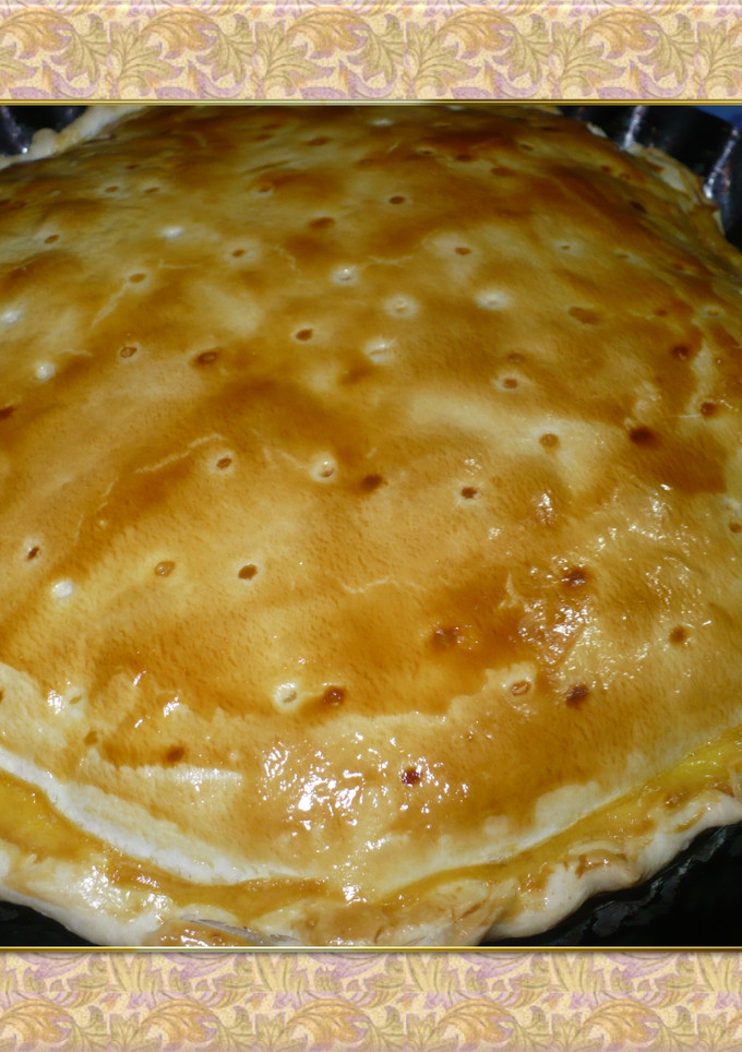 Una foto de Tarta de choclo con salsa blanca y queso