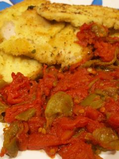 Una foto de Lomo de cerdo empanado con sofrito de pimientos