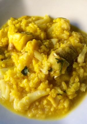 Una foto de Arroz meloso con coliflor y bacalao