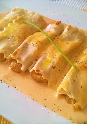 Una foto de Canelones rellenos de Langostinos y Setas variadas