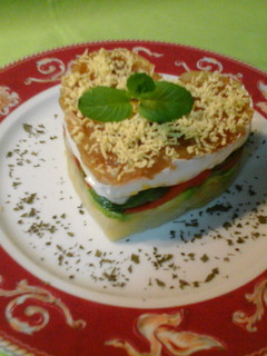 Una foto de Timbal de verduras con queso de cabra