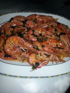 Una foto de Gambón al horno con ajo y perejil