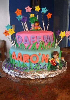 Una foto de Pastel de fondant Nora y Diego