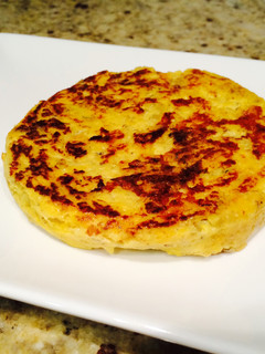 Una foto de Tortilla estilo española de calabaza, trufa y parmesano