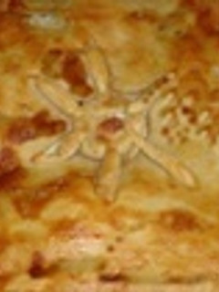 Una foto de Hojaldre relleno de pimientos y carne