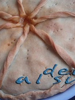 Una foto de Empanada de atún y pollo
