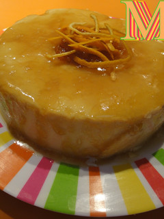 Una foto de Flan de queso y naranja