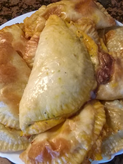 Una foto de Empanadillas de atún y tomate con masa de pizza