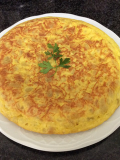 Una foto de Tortilla de patatas con cebolla AMC