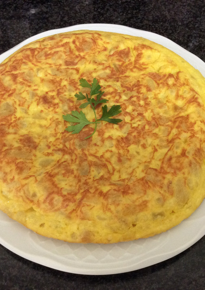 Una foto de Tortilla de patatas con cebolla AMC